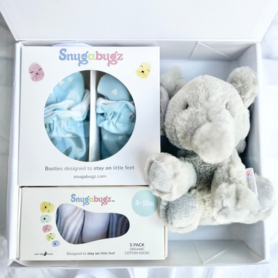 Luxury baby Gift Box Set Containing Snugabugz Blue Booties with non-slip soles and organic cotton Baby Socks That Stay On with Elephant Plush soft toy in magnetic keepsake box