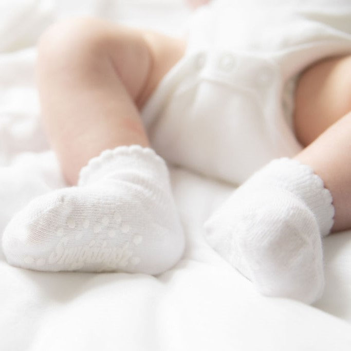 Snugabugz white organic cotton Baby Socks That Stay On Baby's Feet gender neutral infant socks with non-slip soles. Pack of 3 pairs of newborn socks. Baby socks that don't fall off. Baby socks with grips