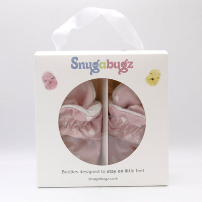 Pink baby girl booties that stay on for infants made with soft organic cotton, sustainable, with flexible non-slip soles. Barefoot soft sole baby shoes. Barefoot soft sole baby shoes in gift box for baby shower gift or new baby girl gift idea.
